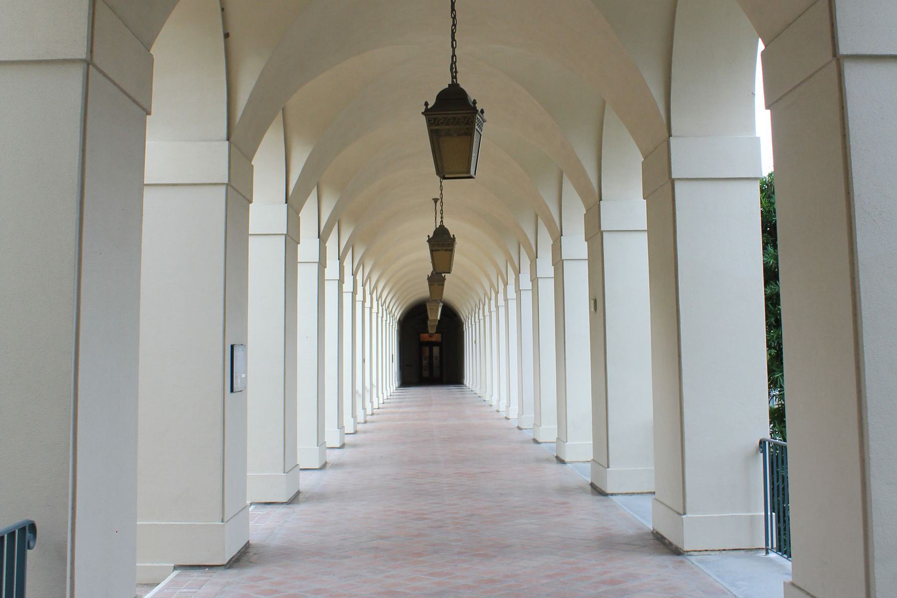 Arched arcade walkway with terracotta tile floor, Pasadena